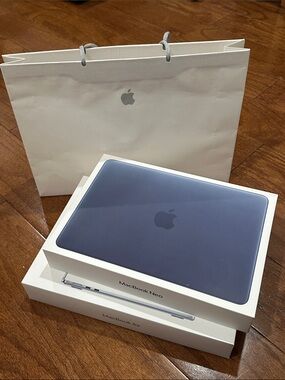Apple paper shopping bag and MacBook boxes empty